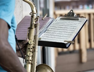 Closeup shot of a man playing saxophone