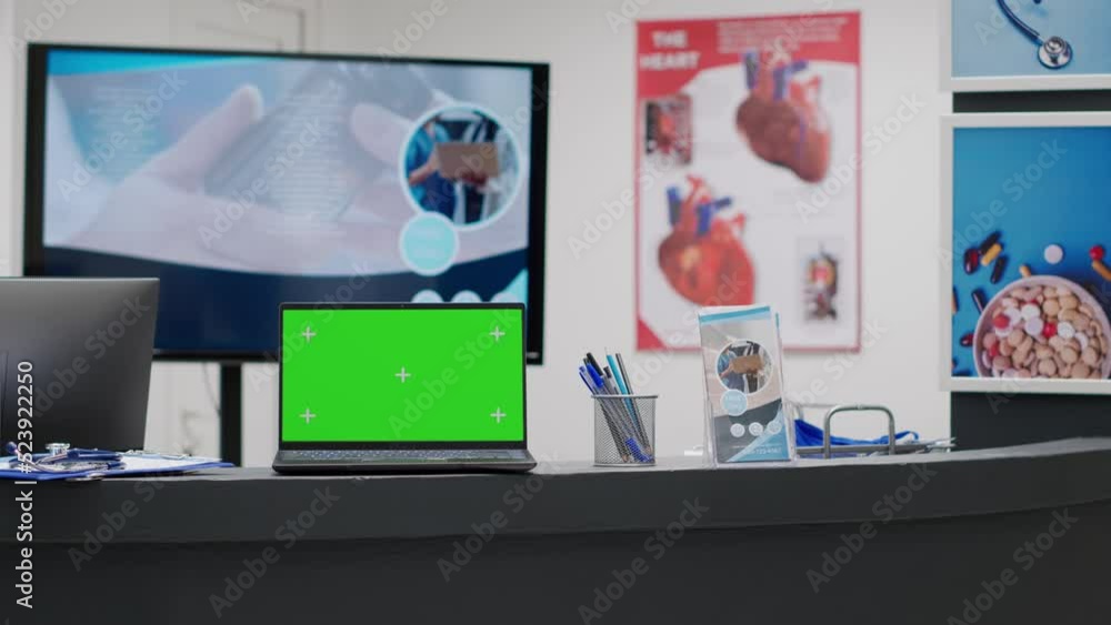 Poster empty reception desk with greenscreen on laptop display, hospital lobby counter. computer with blank