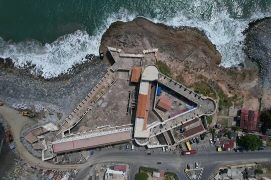 Aerial view of strong waves at the Cape Coast Castle in Ghana