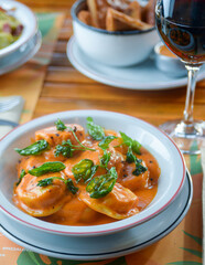 Pasta with basil and a cup of wine