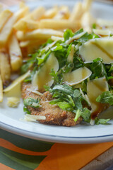 Schnitzel with salad and fries
