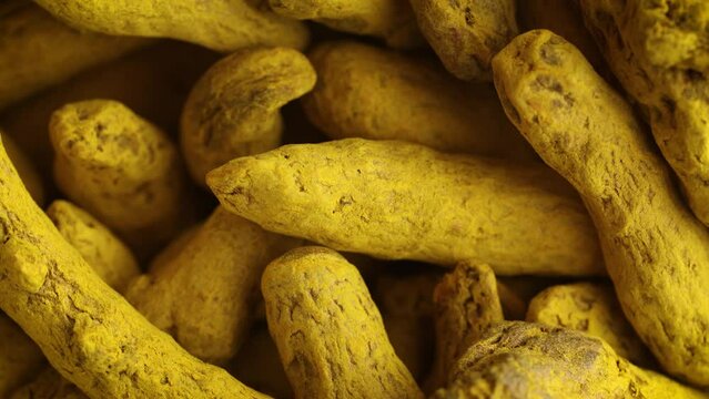 turmeric Curcuma yellow dried roots background