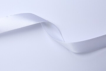 One beautiful silk ribbon on white background