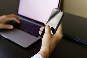 携帯を操作する男性 businessman checking a smartphone