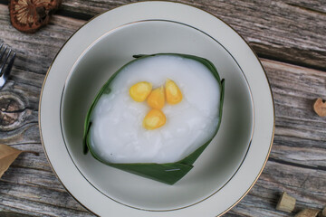 Thai Pudding with Coconut topping on banana leaf(Tako). Jelly coconut cream with corn and taro on top. Thai desert ,Famous
