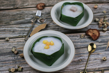 Thai Pudding with Coconut topping on banana leaf(Tako). Jelly coconut cream with corn and taro on top. Thai desert ,Famous