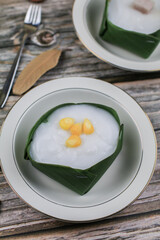 Thai Pudding with Coconut topping on banana leaf(Tako). Jelly coconut cream with corn and taro on top. Thai desert ,Famous