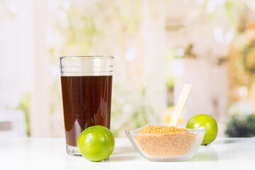 granulated panela or sugar cane sweets and lemon in the kitchen, typical food of Colombia