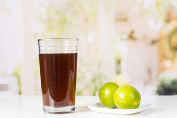 agua de panela and lemon or sugar cane sweets and lemon in the kitchen, typical food of Colombia