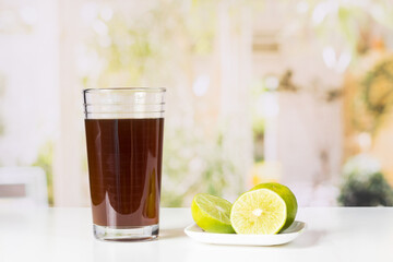 agua de panela and lemon or sugar cane sweets and lemon in the kitchen, typical food of Colombia