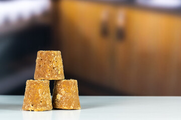 Panela cubes or sweet sugar cane in a kitchen with copy space, typical food of Colombia