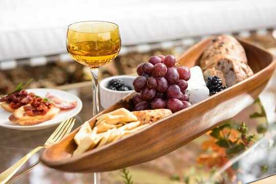 Vertical Shot Of Tasty Lunch, A Fall Cheese Board With Grapes