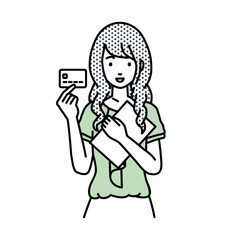 立って書類とカードを手に持つオフィスカジュアルの女性