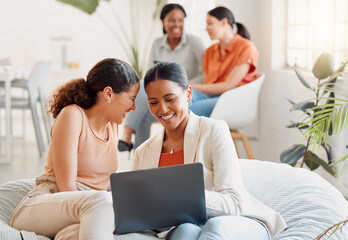 Group of business women on a laptop sitting, laughing looking at social media during a break. Happy ladies bonding on a couch at work. Excited team of girls celebrating new goal achieved at startup