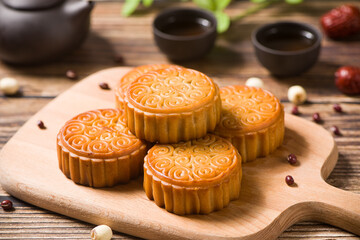 Traditional Chinese mid autumn festival mooncake on wooden table