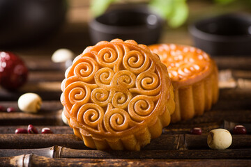 Traditional Chinese mid autumn festival mooncake on wooden table