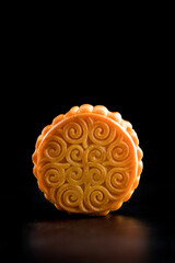 Traditional Chinese mid autumn festival mooncake isolated on black background