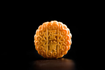 Traditional Chinese mid autumn festival mooncake isolated on black background