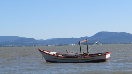 Fototapeta premium boat, beach, summer, speedboat, sunset, beach landscape, rowing boat, ocean sea, ride, boat people, fishing, beach, beautiful day, day, sunny day, blue sky, sea birds, bird , beach house , house near 
