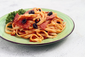 Freshly cooked fettuccine pasta in marinara or tomato sauce