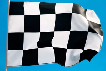 Poster Checkered flag waving on blue background © xy