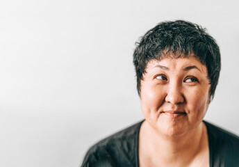 Fototapeta premium Asian woman looking up enjoying expecting sale give away 45 years