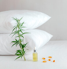Fototapeta na wymiar Pharmaceutical medicine pills, capsules and cbd oil on the bed. Concept sleep disorder. beat insomnia and restore sleeping routine.
