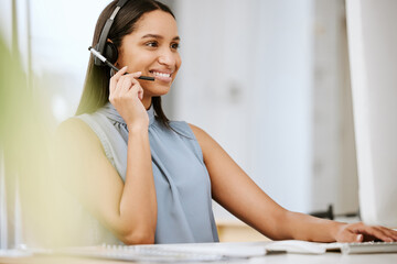 Call center agent, business consultant or telemarketer assisting client online using headset while...