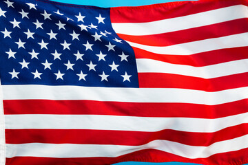 American flag waving on blue background