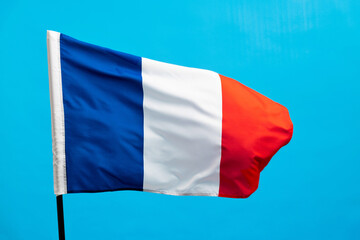 French flag waving on blue background