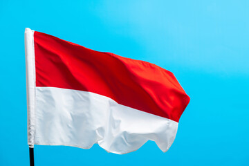 Indonesia flag waving on blue background
