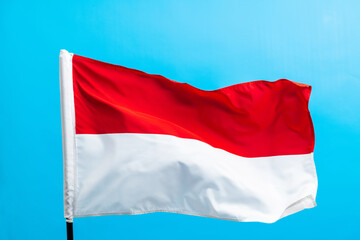 Indonesia flag waving on blue background