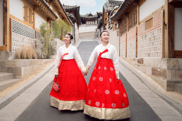 Asian woman traveler in traditional korean dress or hanbok dress