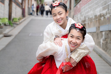 Asian woman traveler in traditional korean dress or hanbok dress
