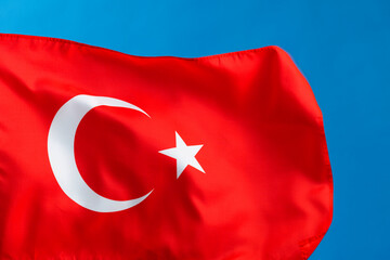 Obraz premium Turkish flag waving on blue background