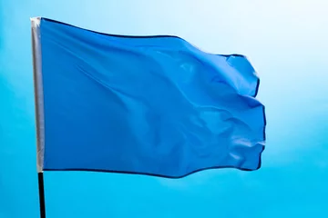 Fotobehang Light blue flag waving on white background © xy