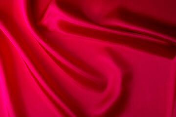 Obraz na płótnie Canvas Close up of dark red silk background
