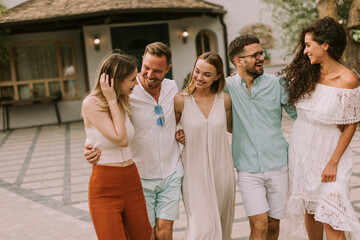 Group of happy young people having fun outdoors