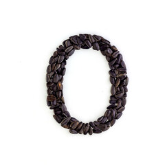 Capital letter O made from sunflower seeds. Alphabet made from sunflower seeds. White background. Sunflower seed font
