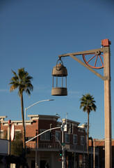 Late afternoon view of a light post framing the historic Old Town of Scottsdale, Arizona, USA.