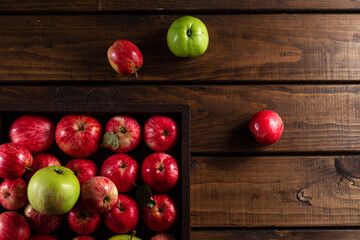 Ripe apples on a wooden background