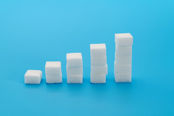 Sugar cubes chart on blue background