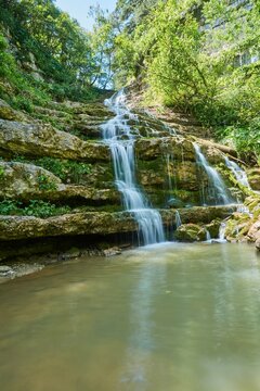 Mountain waterfall in the forest, a large noisy stream of water © Fotoproff