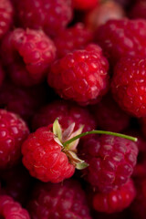 Background of macro berries of ripe and juicy raspberries