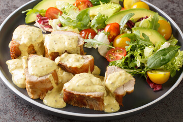 Fried pork tenderloin served with mustard honey sauce and lettuce, avocado and tomato salad...