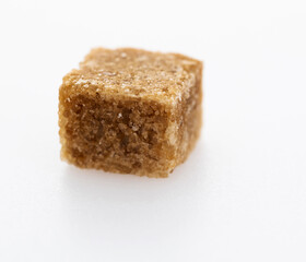 Brown sugar cube on white background