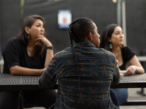 High school teacher and students outside during lunch