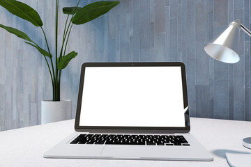 Fototapeta premium Close up of modern grunge style workplace with empty white mock up laptop screen on desktop. 3D Rendering.