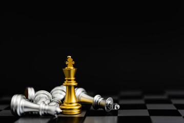 Chess game gold and silver on black background.