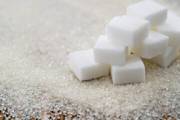 Sugar cubes on top of granulated sugar
